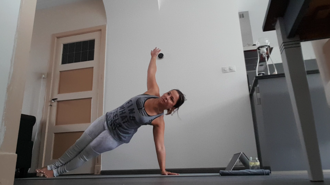 Photo of Biddy doing a side plank supporting herself on her previously injured wrist